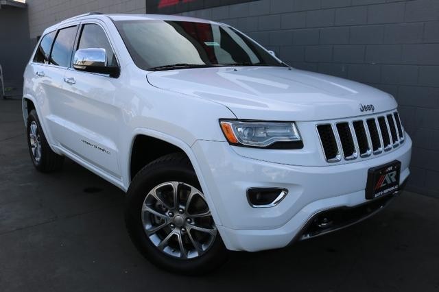 Pre-Owned 2014 Jeep Grand Cherokee 4WD Overland Sport/Utility in Orange ...